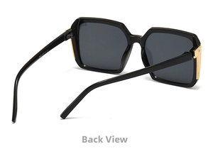 Detail view of square black sunglasses with golden metal hinges and inner temple specs