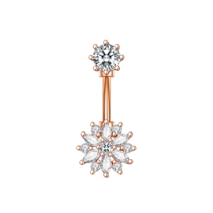 Macro shot of rose gold belly piercing ring with sparkling white zircon floral design