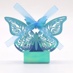 Laser-cut butterfly candy box in blue gradient paper with a matching silk ribbon bow