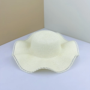 Elegant wide brim straw hat with lace edges for summer beach vacation and outdoor travel