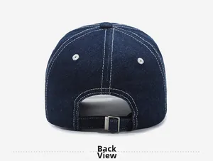 Detail view of denim baseball cap with adjustable metal buckle and contrast stitching