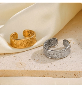 Detailed view of gold and silver adjustable open rings with retro geometric textures