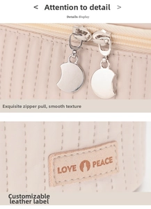 Detailed close-up of quilted PU leather pouch with metal moon-shaped zippers and leather logo