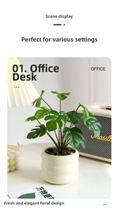 Close-up of realistic faux monstera plant with ribbed ceramic pot and black stones
