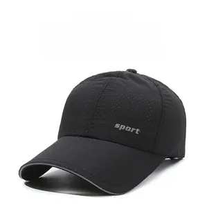 Close-up of black quick-dry mesh fabric and reflective brim detail on baseball cap