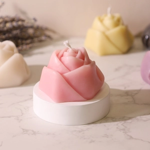 Pink rose pillar scented candle on white base for home decor and festive gifts