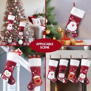 Christmas stockings set with Santa and reindeer hanging on fireplace and tree
