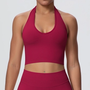 Detail of high-impact halter neck sports bra in burgundy ribbed knit fabric