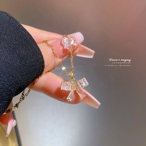Titanium butterfly necklace with gold plating and sparkling cubic zirconia crystals