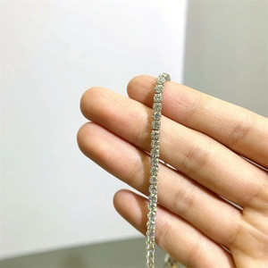 Sparkling S925 sterling silver moissanite tennis bracelet for women held in hand