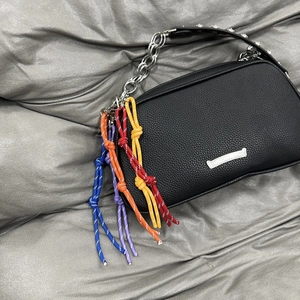 Black pebbled leather handbag with silver chain and colorful woven rope knot charms