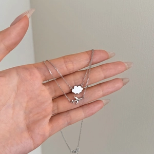 S925 Sterling Silver double layer necklace featuring airplane and cloud charms on hand