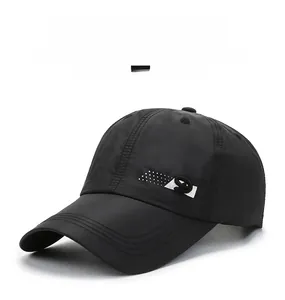 Detailed view of black breathable quick-dry baseball cap with side logo and ventilation holes