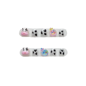 Cute kids cow-themed press-on nails with 3D cow head and lollipop resin charms