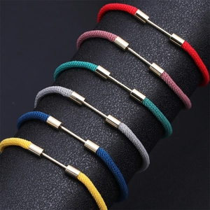 Close-up of adjustable woven Milan ropes in multiple colors with golden metal accents