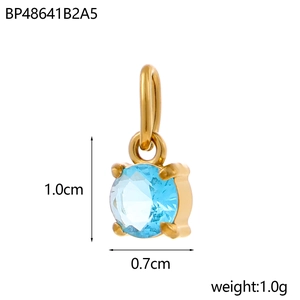 Detail of light blue zircon pendant with gold claw setting and 1.0cm dimension scale