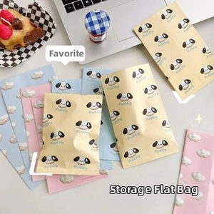 Detail of cute puppy and cloud pattern storage bags in pink, blue and beige colors