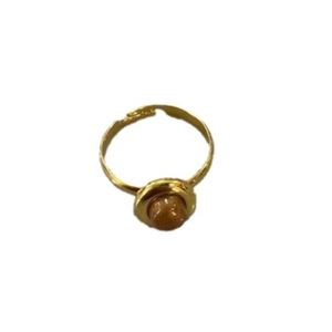 Minimalist gold oval open ring with a round brown gemstone in a classic bezel setting
