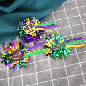 Detail of Mardi Gras crown, mask, and top hat decorations in purple, green and gold colors