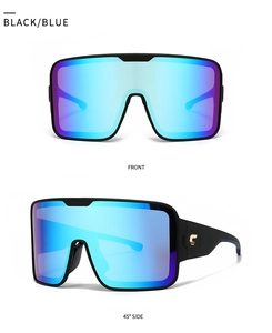 Detail view of oversized mask sunglasses with blue-purple lenses and gold side logos