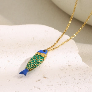 Detailed close-up of 18K gold plated fish pendant with blue and green enamel scales