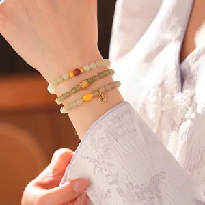 Three-layer faux Hetian jade and beeswax bracelet set with golden Fu character pendant