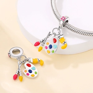 Silver artist charm set with colorful enamel palette and paintbrush on snake chain