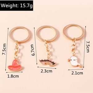 Detailed view of Halloween keychains featuring bat, ghost and hat with dimensions