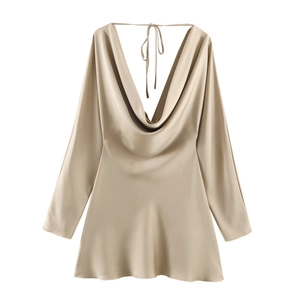 Detail of champagne gold satin mini dress featuring a cowl neck and smooth silky texture