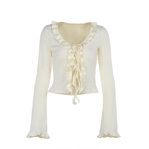 Blouse élégante beige à col en V, manches longues avec ourlet volanté et détails lacés