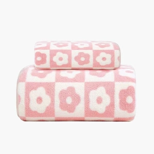 Pink and white checkered coral fleece towel set with soft high-density plush texture