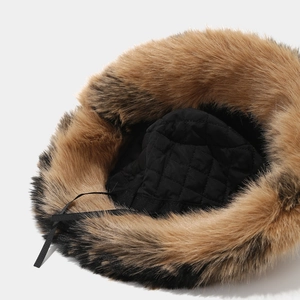Thick winter faux fur bucket hat with warm quilted lining and plush brown finish