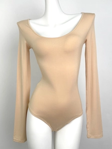 Detail of skin-toned long sleeve bodysuit in ribbed stretch fabric on a mannequin