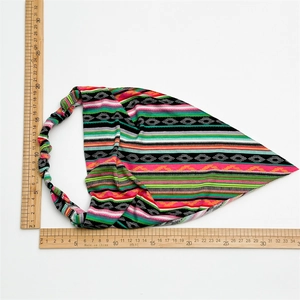 Flat lay detail of bohemian printed headband with measurements on white background