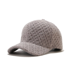 Detailed side view of grey knit baseball cap showing thick warm diamond texture