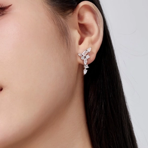 Close-up of elegant S925 sterling silver earrings with clear cubic zirconia on model