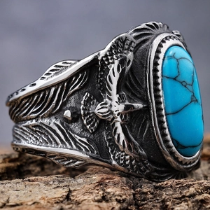 Detailed macro view of vintage eagle ring with turquoise stone and feather relief