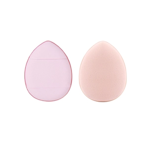 Detailed view of pink teardrop mini finger puffs with smooth and textured sponge surfaces
