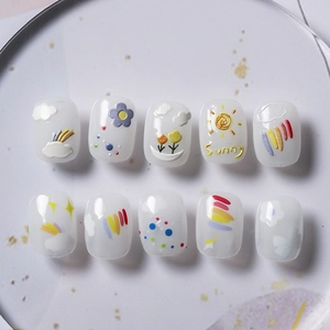 3D rainbow and sun press-on nails with white translucent finish and sunny motifs