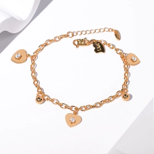 Detailed view of a gold heart bracelet with sparkling zircon stones and S925 stamp