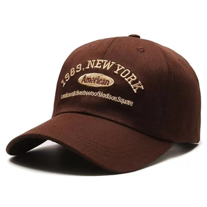 Retro brown baseball cap with New York 1989 embroidery shown from a 45-degree angle