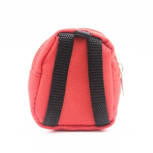 Detailed view of a mini red canvas backpack keychain with zipper and black straps