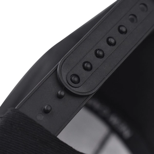 Detail view of the black snapback adjustable plastic closure on a flat brim hip hop hat
