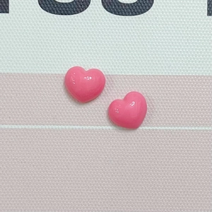 Detail view of pink macaron resin hearts for hair clips and DIY accessories