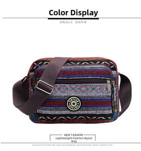 Detail view of colorful striped canvas crossbody bag with star logo and adjustable strap