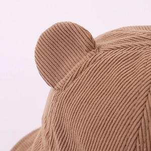 Detail of brown corduroy baby bear ears hat showing thick texture and stitching