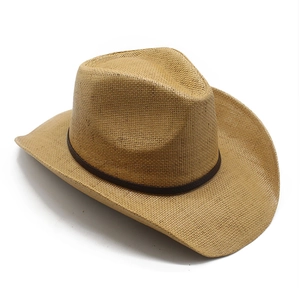 Detail of the woven straw texture and leather band on a western cowboy sun hat