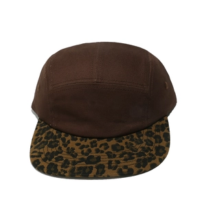 Front view of a 5-panel cap with brown crown and leopard print flat brim