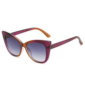 Stylish cat-eye sunglasses with purple and orange gradient frames shown from 45-degree angle