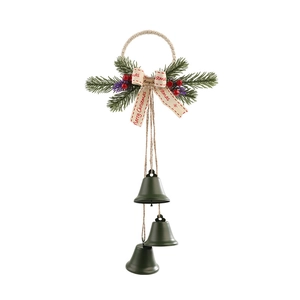 Christmas hanging decor with green metal bells, pine needles, red berries and Merry Christmas ribbon